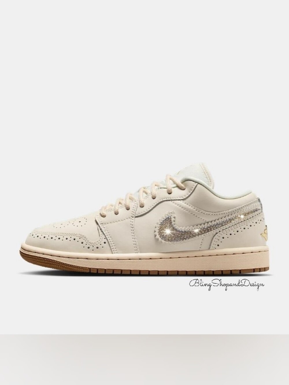 Nike Air Jordan 1 Women’s Low-Top Sneakers in Cream with Gold Sparkle Swoosh